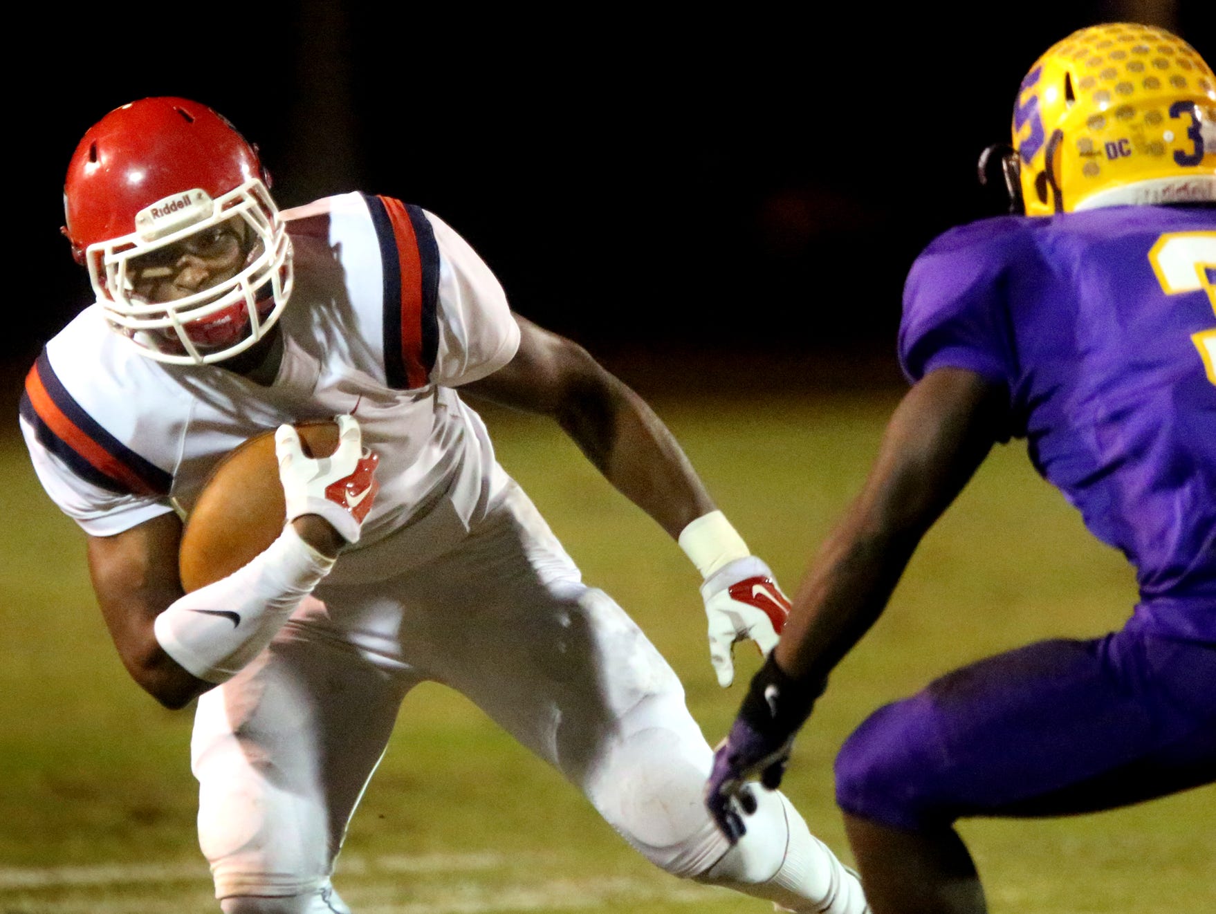 Oakland's JaCoby Stevens (7) runs the ball as Smyrna's AJ Carter (3) moves in to stop Stevens during the game at Smyrna, on Friday Oct. 30, 2015.
