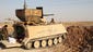 Militia troops from Kataib Hezbollah position an armored vehicle near Amerli.