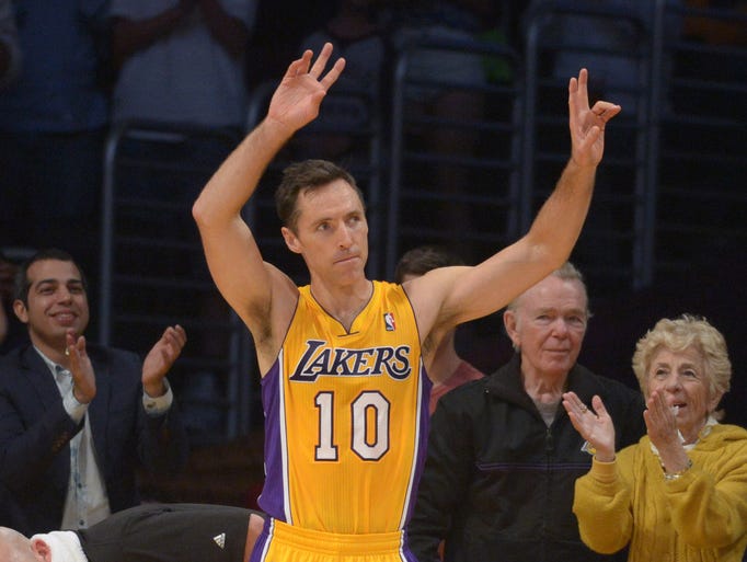 Lakers guard Steve Nash  acknowledges the crowd after