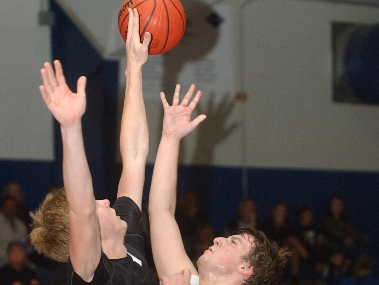 Cotter’s Matthew Gorbet has his shot tipped by Marshall’s Bub Deckard during the Warriors’ 56-44 loss to the Bobcats on Monday night.