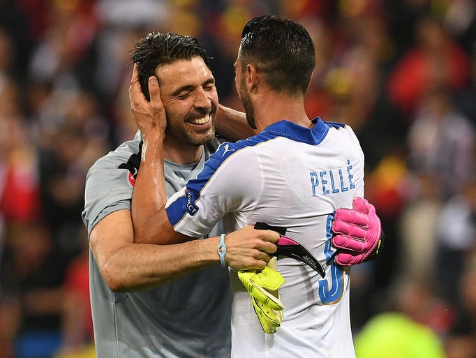 Italy's forward Pelle (R) celebrates with Italy's goalkeeper