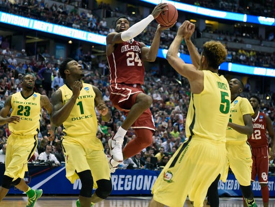 Oklahoma Sooners guard Buddy Hield (24) moves in to