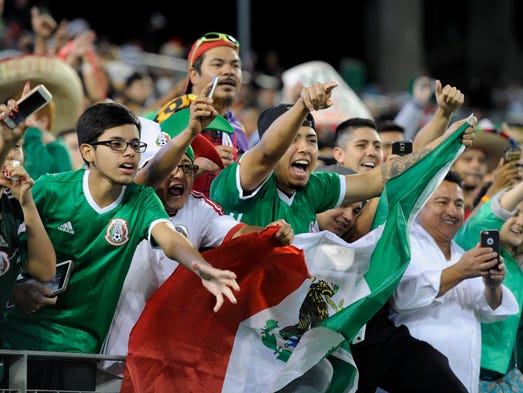 Mexican fans celebrate their team's 2-1 victory over