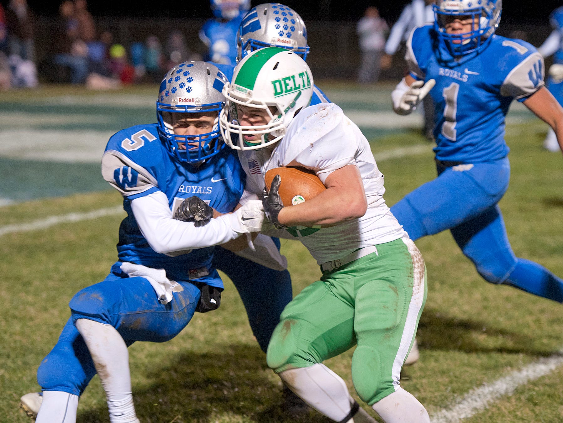Wynford's Cole Fortner pushes against the Delta offense.