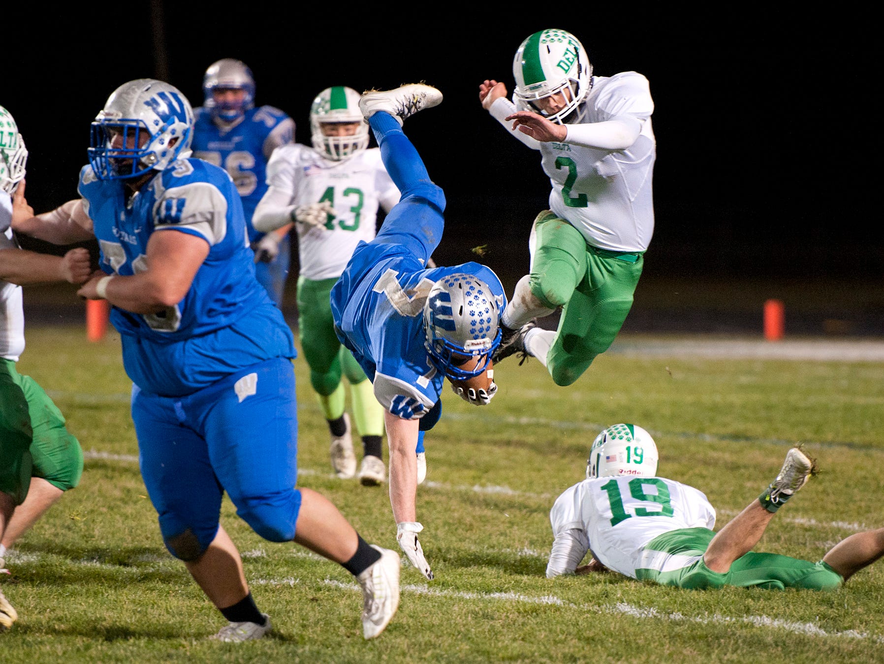 Wynford's Nick Looker is tripped up by Delta's defense.