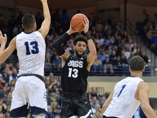 Gonzaga guard Josh Perkins is defended by San Diego