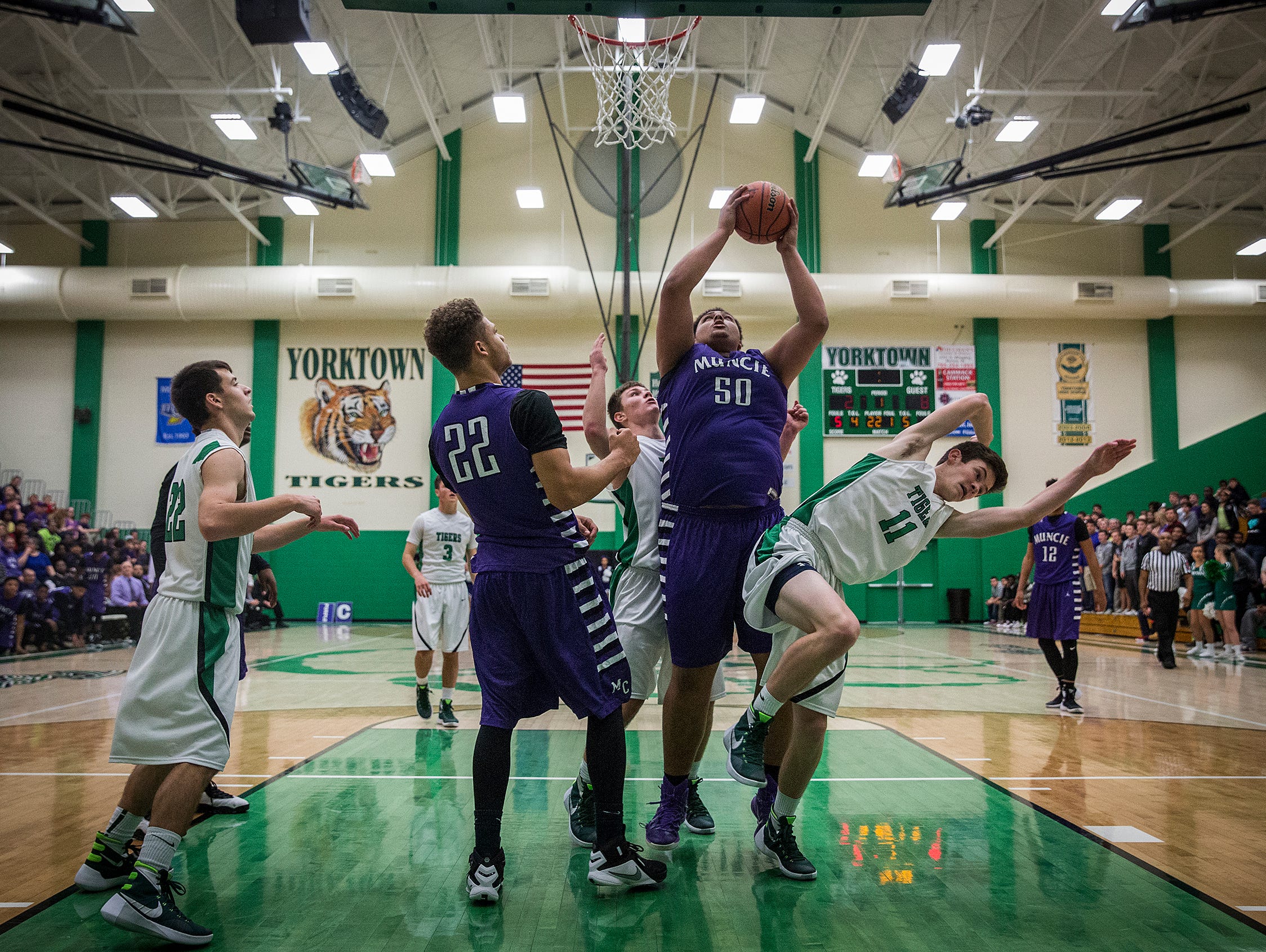 Central's Donald Allen goes up for a shot against Yorktown during their game at Yorktown High School Saturday, Nov. 28, 2015.