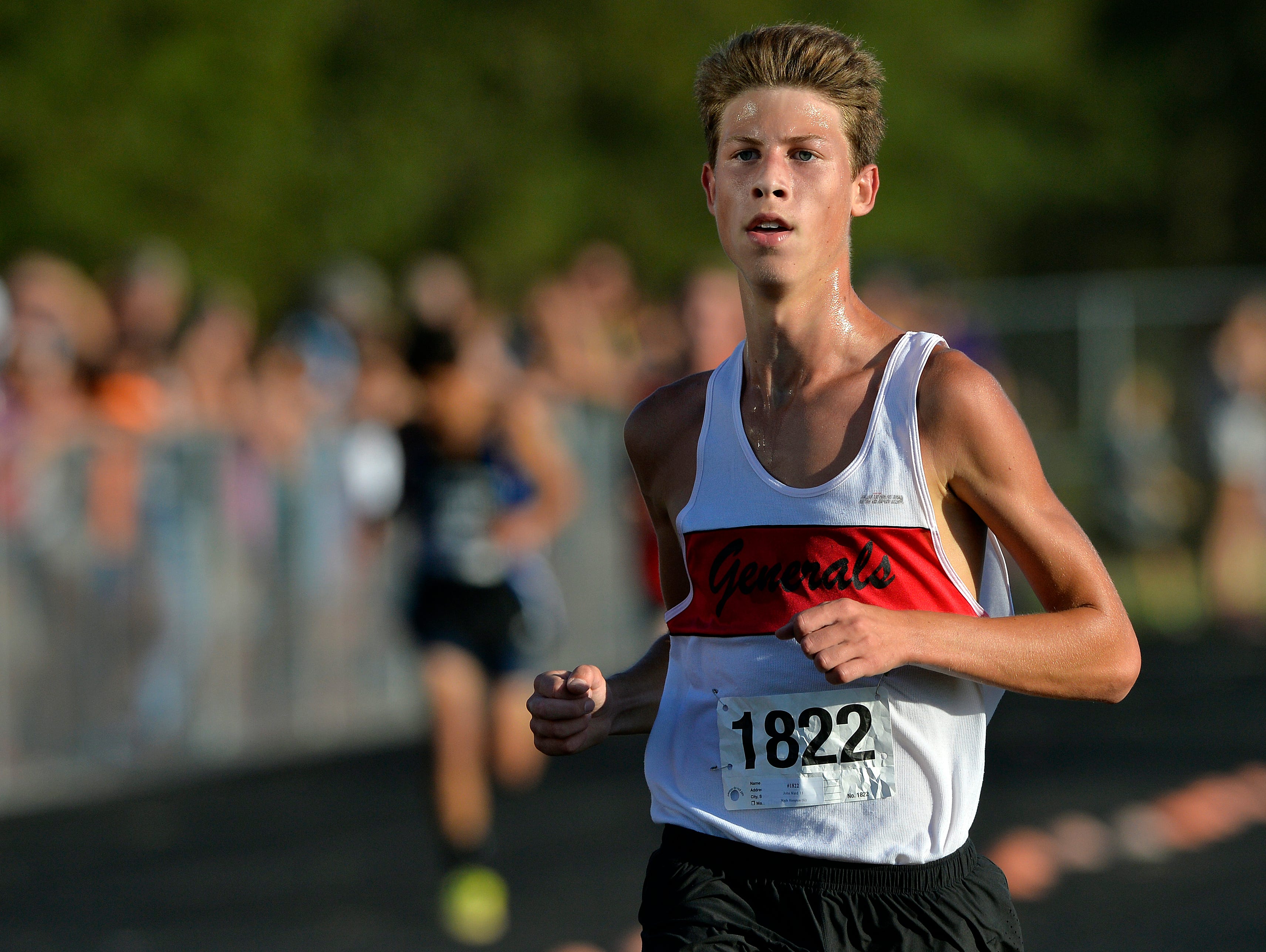 Wade Hampton's John Ward wins the boys varsity Canned Food 5k cross country race at Hillcrest High School on Wednesday, September 23, 2015.