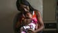 Leticia de Araujo holds one month old daughter, one-Manuelly