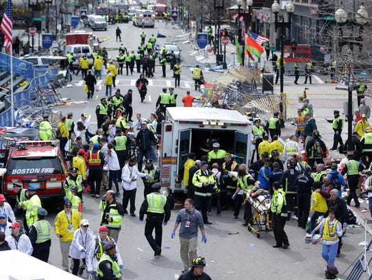 Medical workers aid injured people at the finish line