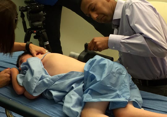 Dr. Sumeet Garg uses magnets to elongate Ryan Viano's