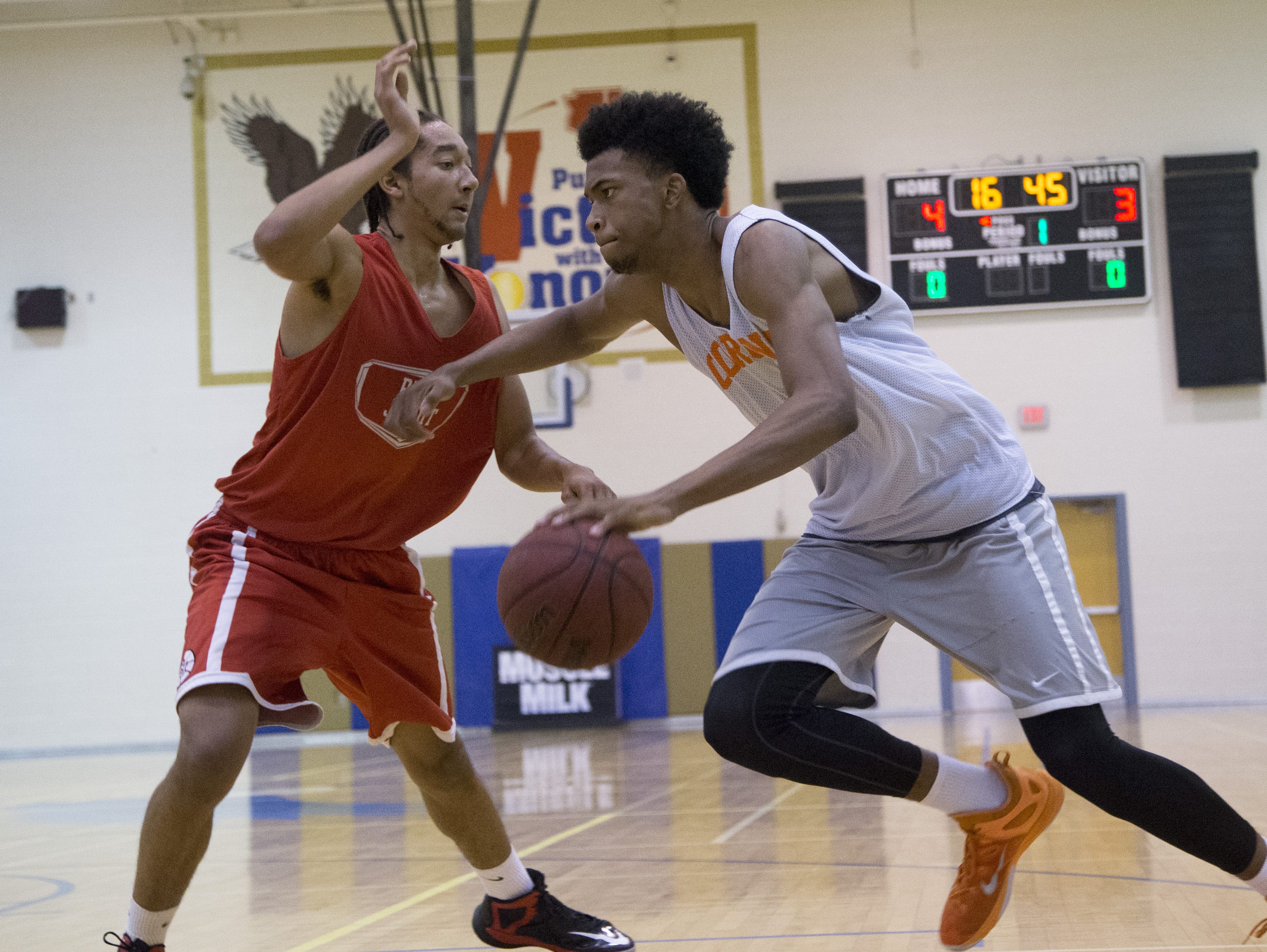 Regis Jesuit's Geoff Kelly guards Corona del Sol's Marvin Bagley III during Best in Basketball Summer Invitational at Sandra Day O'Connor High School in Phoenix on June 26, 2015.
