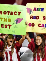 Arizona Cardinals fans cheer during preseason action