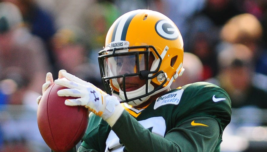 Green Bay Packers safety Morgan Burnett grabs the ball during training camp practice at Ray Nitschke Field, Monday, July 28, 2014.