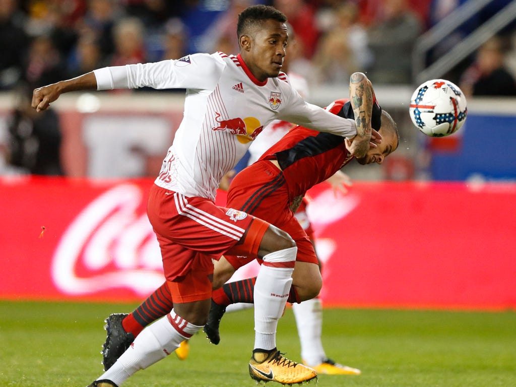 New York Red Bulls defender Michael Murillo, left,  and Toronto FC forward Sebastian Giovinco battle for the ball in the Eastern Conference semifinal at Red Bull Arena in Harrison, N.J.