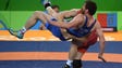 Kyle Snyder of the United States picks up  and Albert