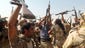 Iraqi volunteers celebrate the breaking of the Islamic State siege as they advance toward Amerli.