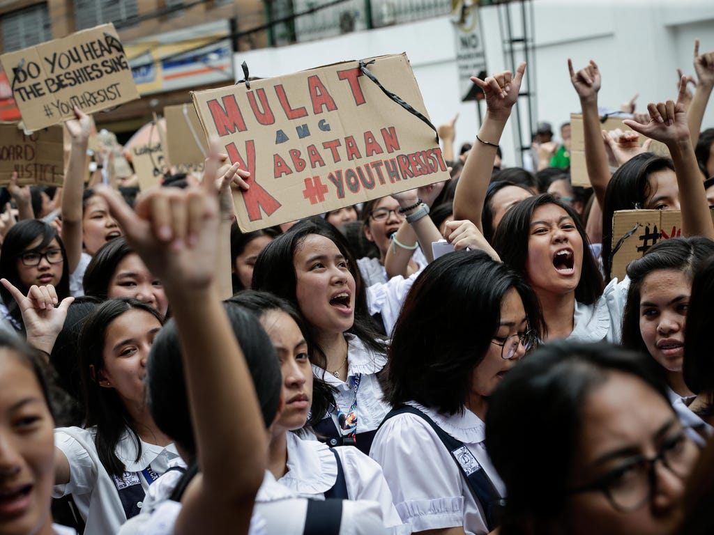 Filipino students shout slogans during a protest in Manila, Philippines on July 18, 2017. Various youth groups staged a protest against the government's war on drugs which has led to at least 7,000 deaths and 12,000 homicide cases, the groups said.