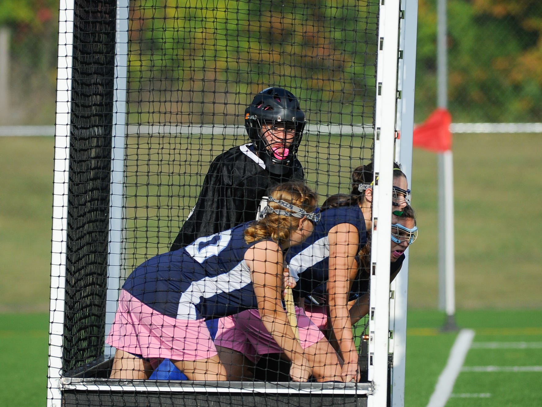 Lake Forest field hockey goalie Allison Bishop (No. 16) defends in their game against Milford.