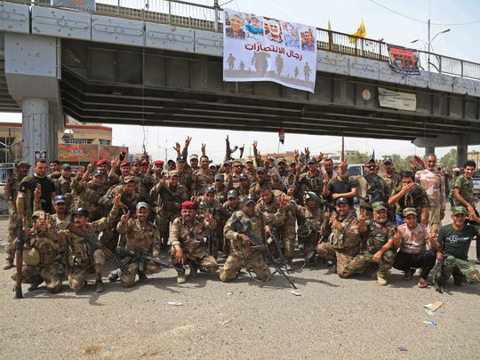 Iraqi security forces celebrate their victory in Fallujah,