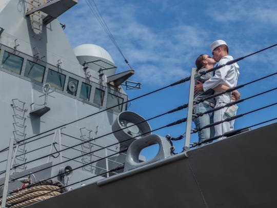 Operations Specialist Jacob Cowger kisses his wife