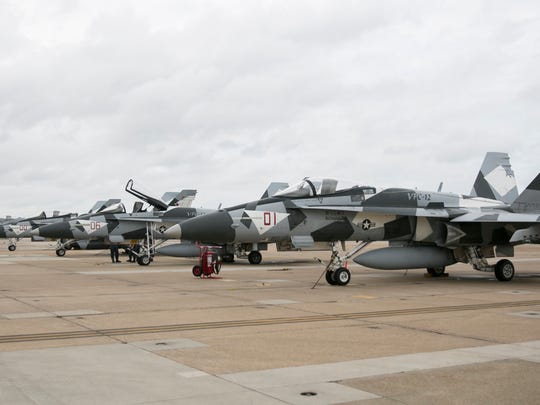 The squadron's Hornets are camouflaged with gray and