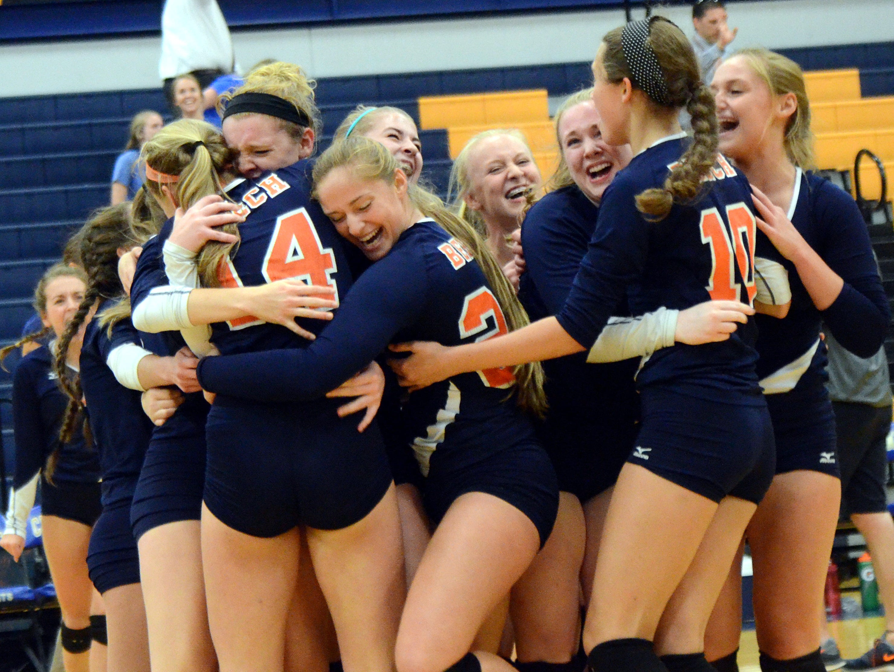 The Beech High School volleyball team celebrates after winning the District 9-AAA Tournament on Thursday evening.