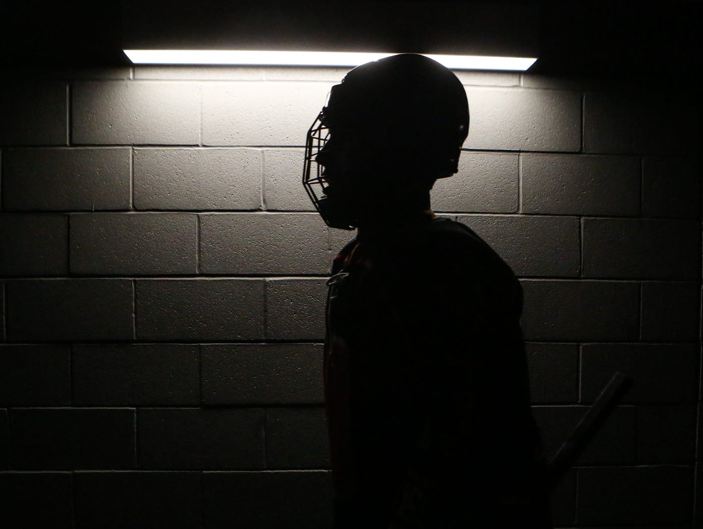 A silhouette photograph of Mamaroneck player heading to the ice rink. Mamaroneck defeated West Genesee 1-0 and won the NYSPHSAA Division 1 HarborCenter in Buffalo, NY.