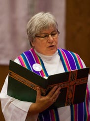 Pastor Sue Ringler, seen in 2013, and some women in
