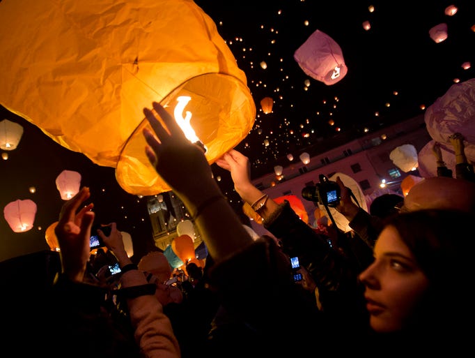 Paper lanterns are released during Christmas festivities