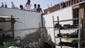 People survey damage to a house in Netivot, Israel, that was caused by a rocket from the Gaza Strip.
