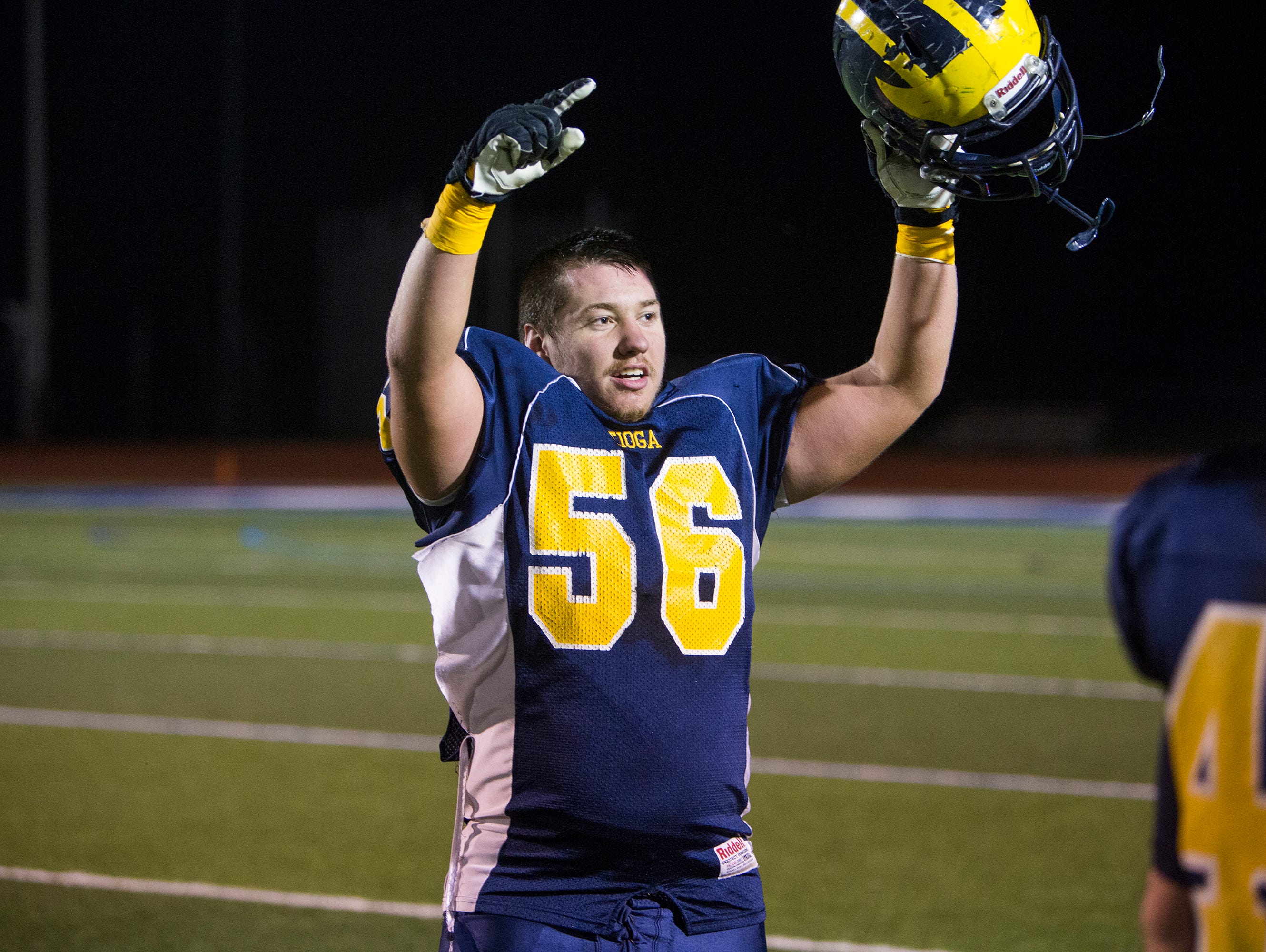 Tioga's Austin Payne gestures towards the crowd after the Tigers held on to beat Bishop Kearney 38-36 in the Class D state playoff semifinals at Cicero-North Syracuse on Friday, Nov. 20, 2015.
