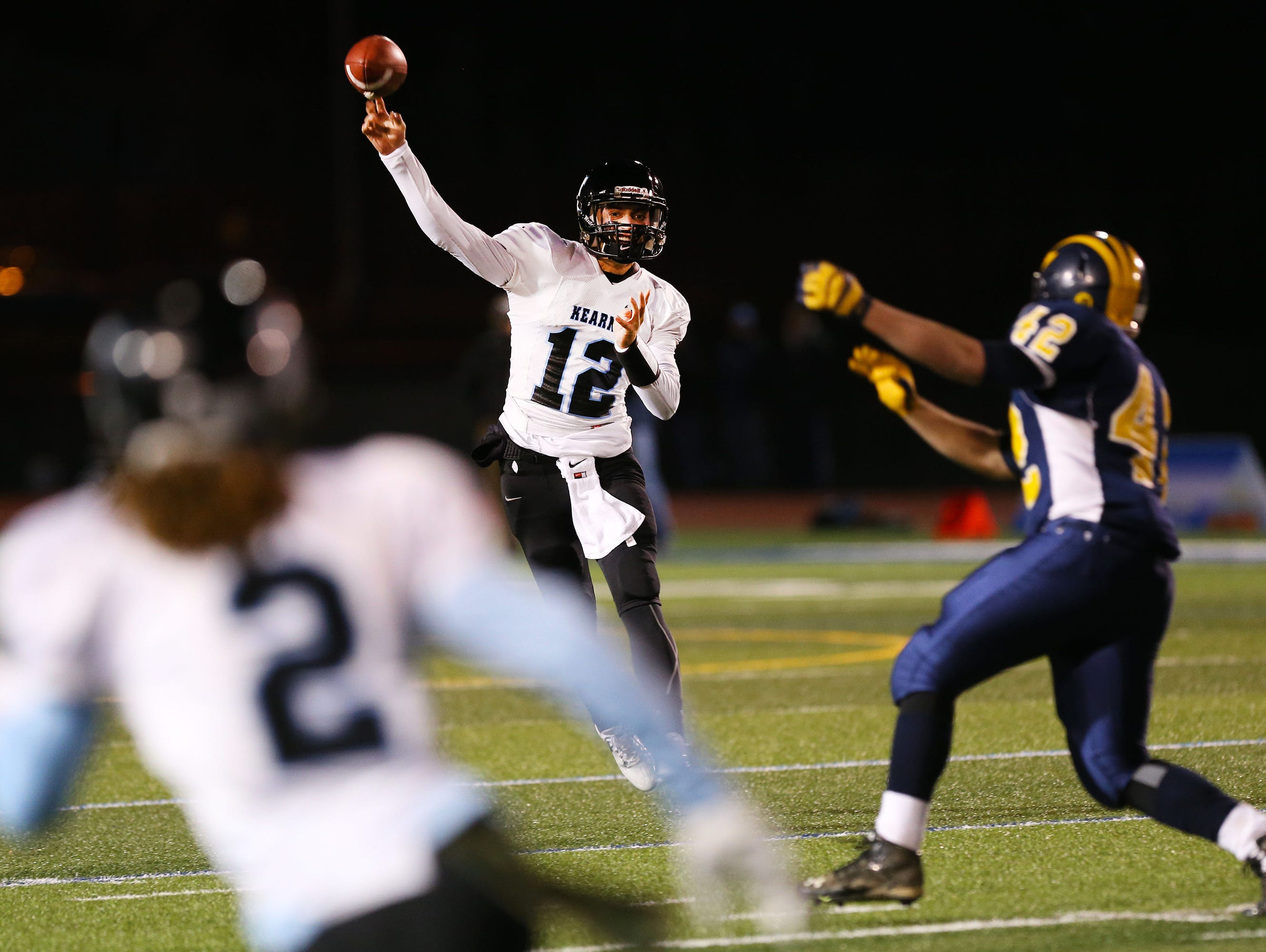 Bishop Kearney's Todd LaRocca passes to Justin Davis during the Class D state semifinal game at Cicero-North Syracuse High School on Friday, November 20, 2015.