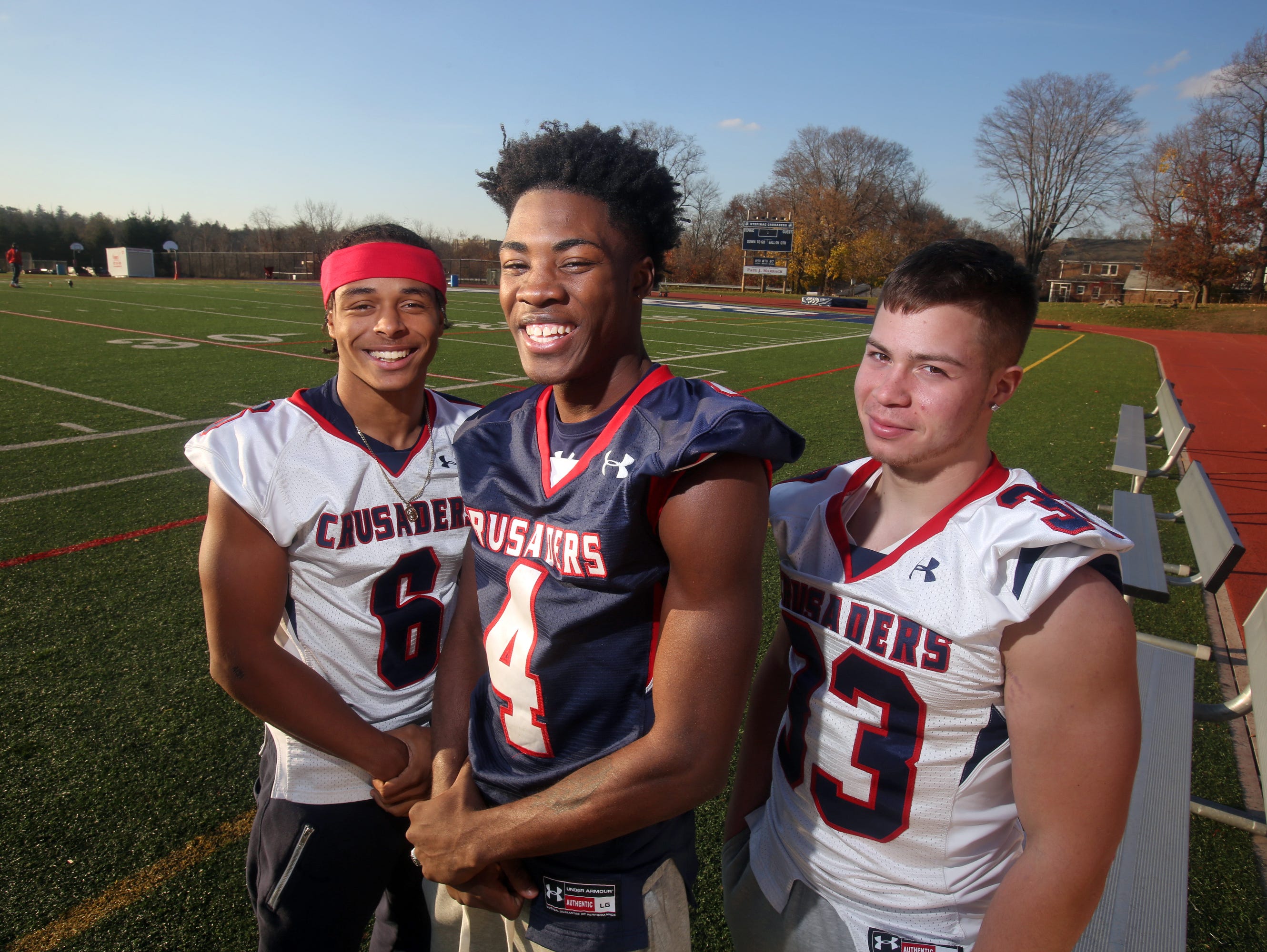 Stepinac High School football players T.J. Morrison, left, Tyquell Fields, and Daniel Negron will lead the Crusaders as they play St. Francis in the second annual CHSAA state championship, Saturday at Grand Island High School. The Crusaders lost in the same game last year.