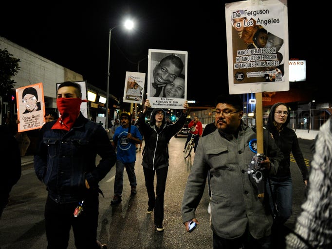 Protesters march down Crenshaw Blvd from Leimert Park