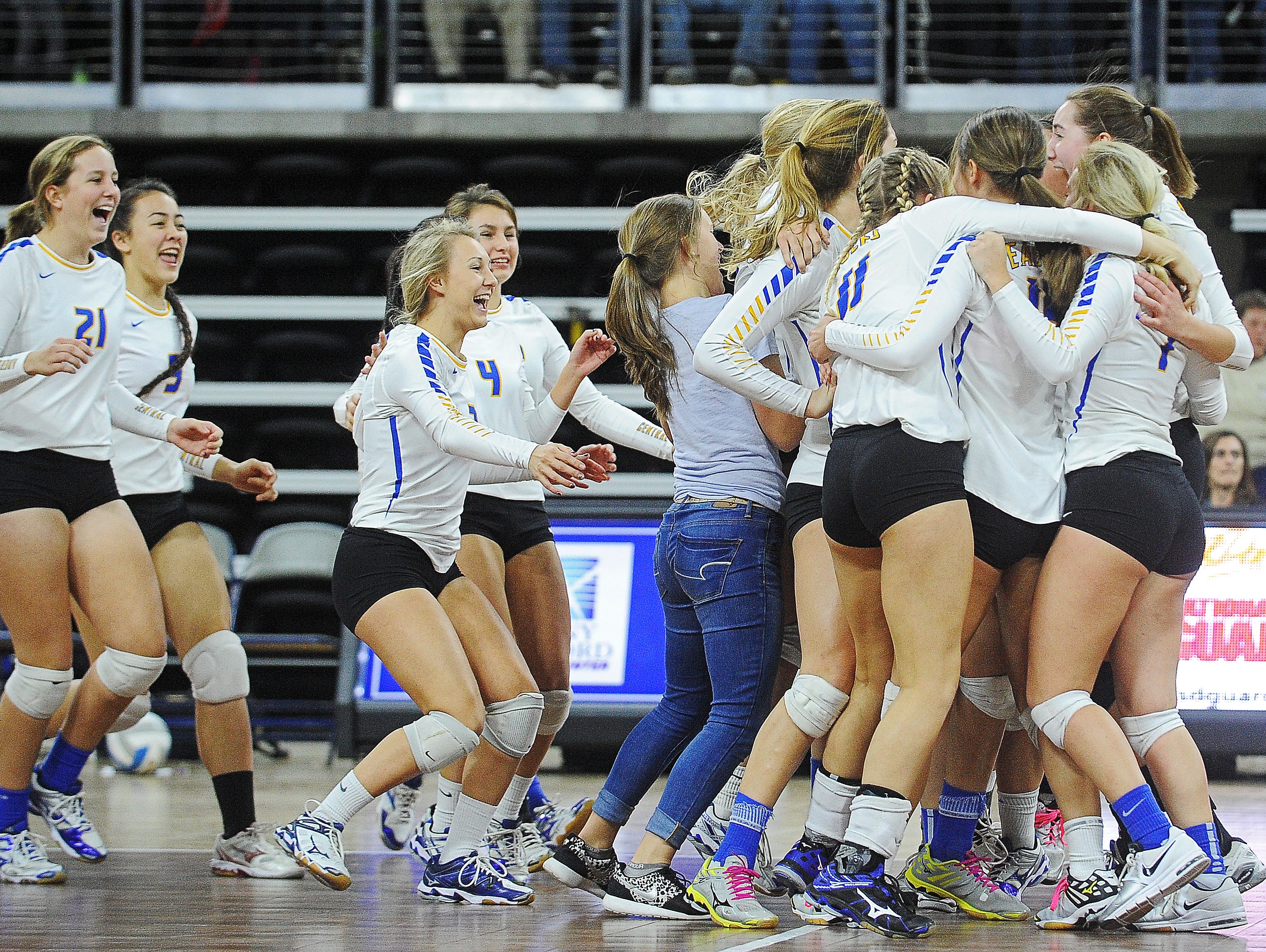 Aberdeen Central players react after defeating Brandon Valley in the South Dakota State High School Class AA championship volleyball match Saturday, Nov. 21, 2015, at the Denny Sanford Premier Center in Sioux Falls.
