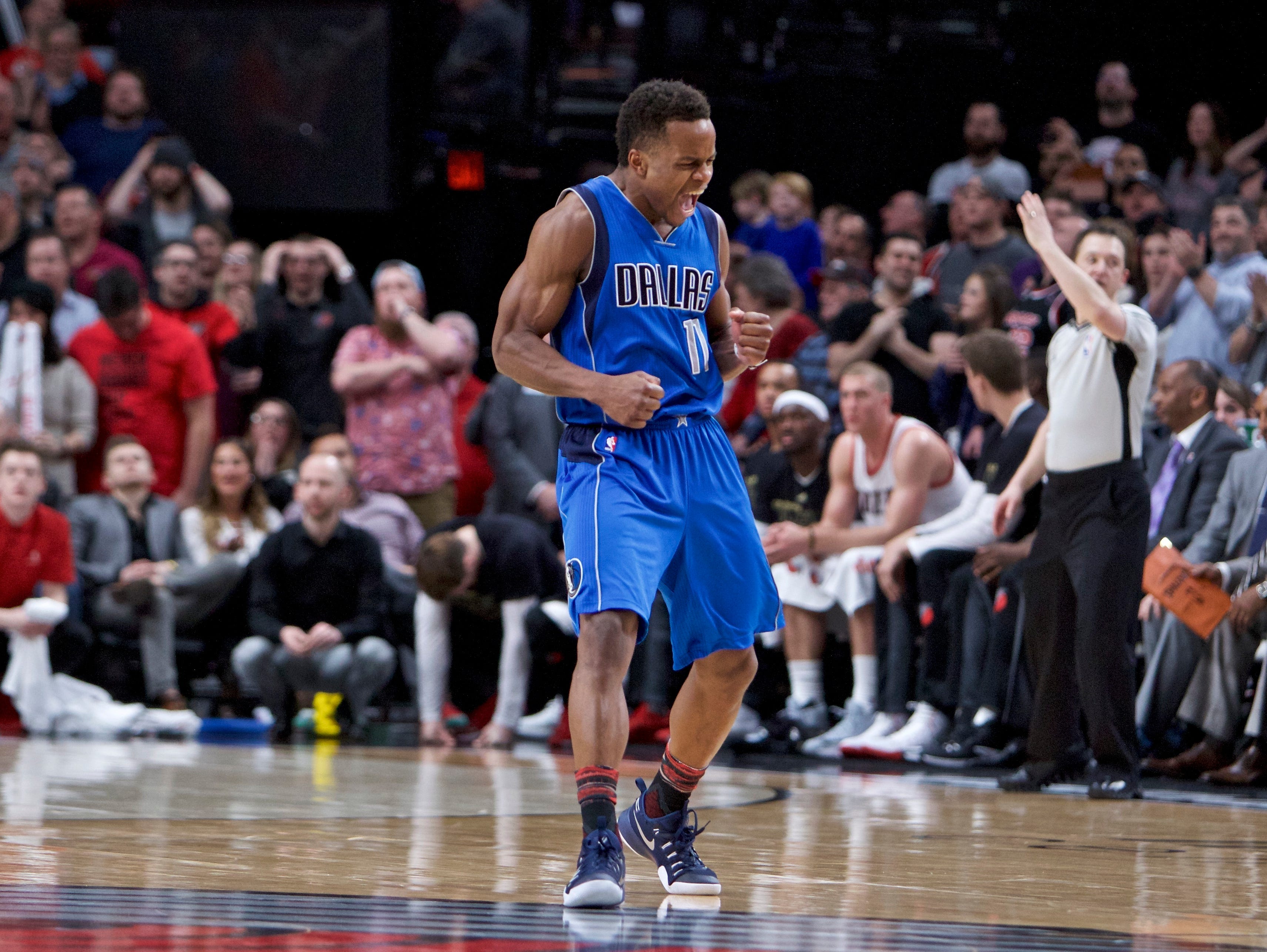 Dallas Mavericks guard Yogi Ferrell reacts after making a 3-point basket against the Portland Trail Blazers during the second half of an NBA basketball game in Portland, Ore., Friday, Feb. 3, 2017.