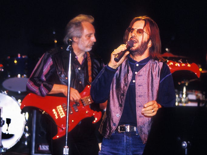 VANCOUVER, CANADA: John Entwistle plays with the Ringo Starr in the summer of 1995 in Vancouver, Candada. Entwistle died June 27, 2002. (Photo by Jeff Vinnick/Getty Images)