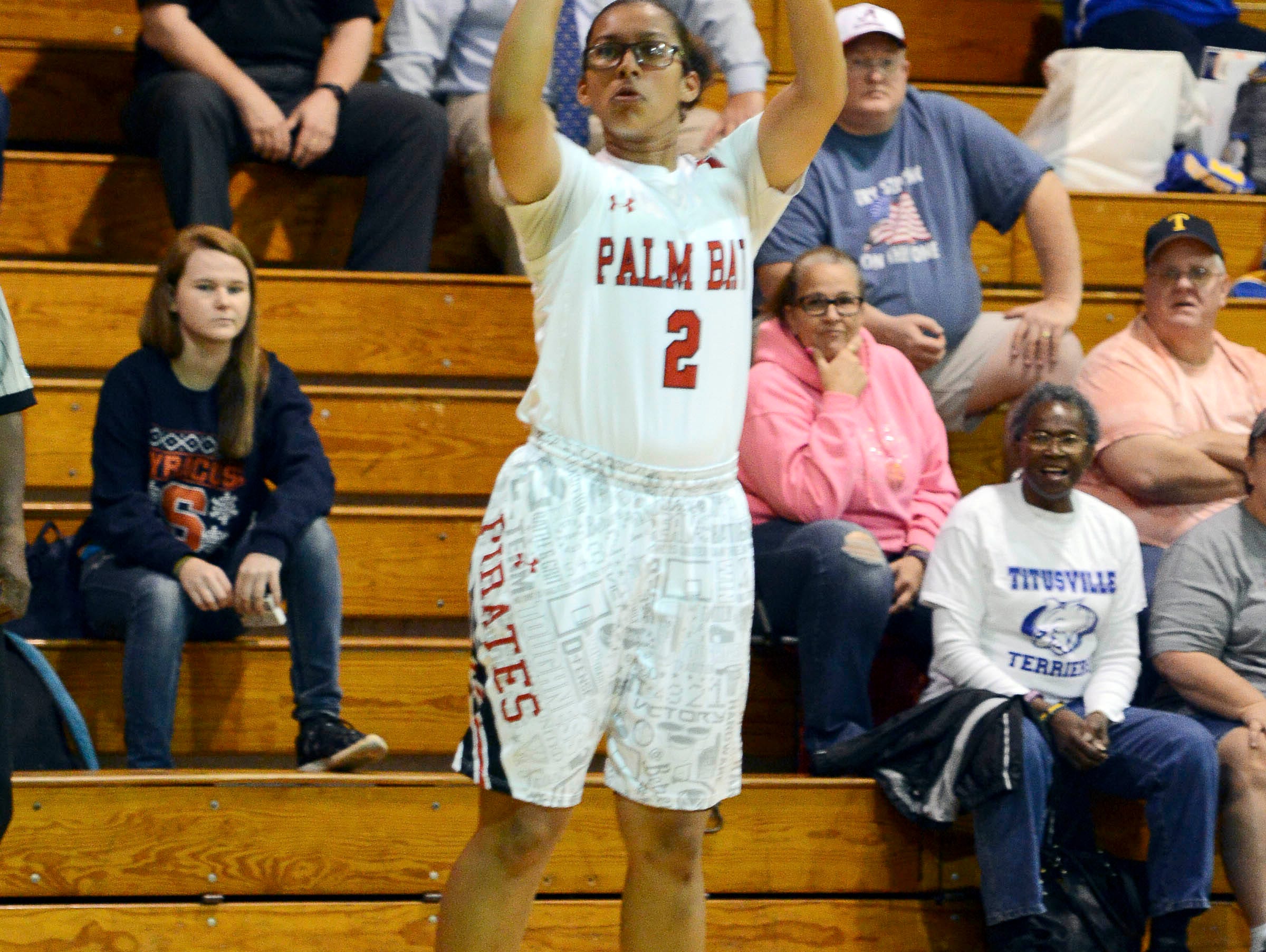 Palm Bay's Mary Penland-Holmes takes a shot during Thursday's district semifinal in the Merritt Island gym.