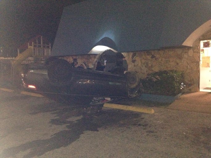 Two women were hurt overnight when their car landed upside down in the parking lot of the Achievement Center for Early Learning building on Busch Blvd.