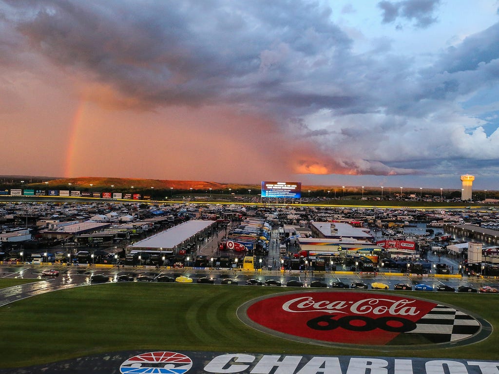 A rainbow appears in the distance  after the rain delay during the Coca-Cola 600 at Charlotte Motor Speedway.