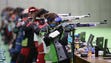 Shooters take aim during the 10-meter air rifle qualification