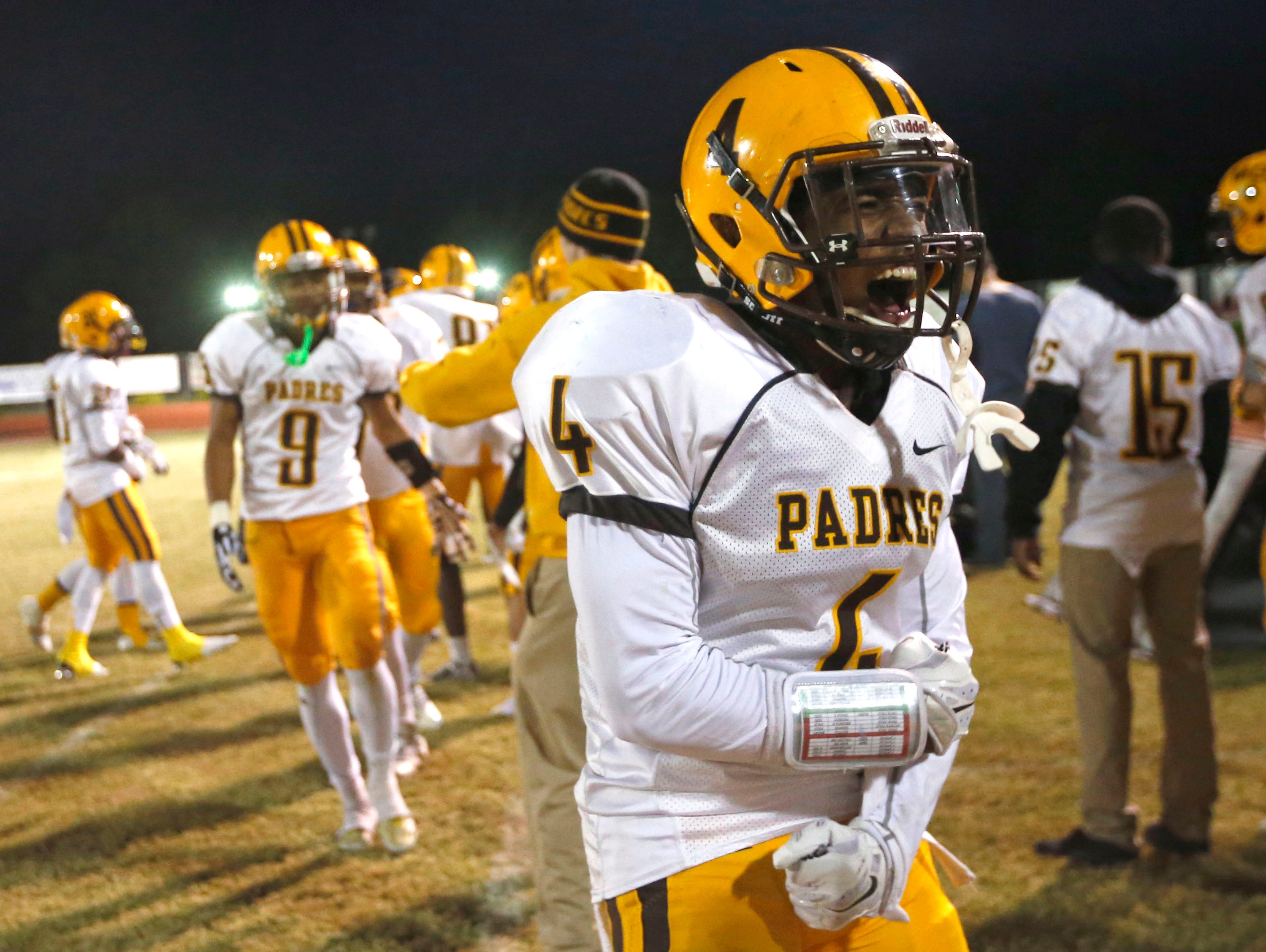 Marcos de Niza's Shaun Richards celebrates after defeating Skyline during the Division II high school football state semifinals at Mountain View High school in Mesa on November 20, 2015.