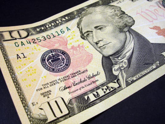 close up of american $10 bill with Alexander Hamilton