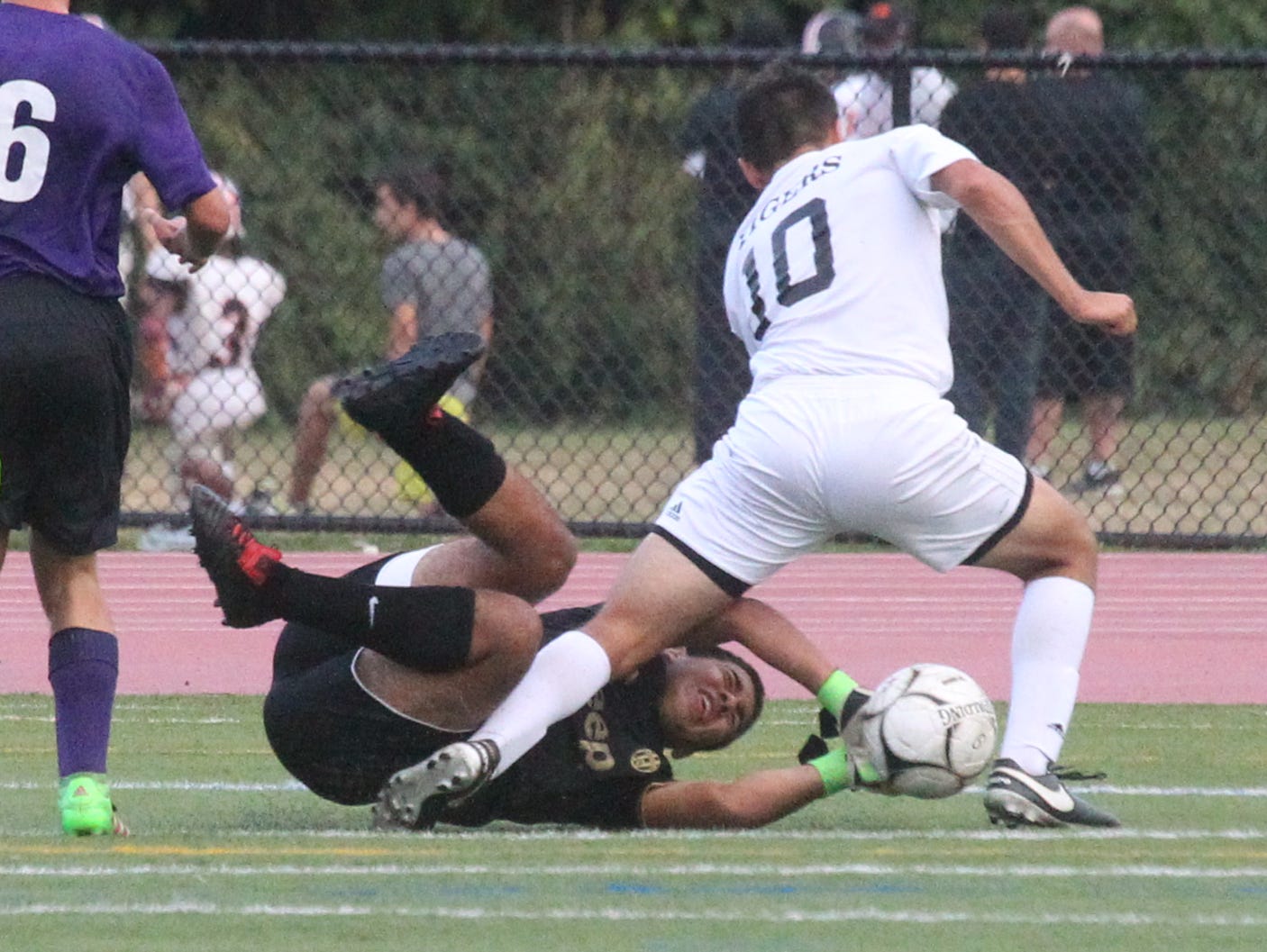 New Rochelle goalie Danny Ayala stops White Plains' Alessandro Battaglia during their game at White Plains Sept. 26, 2016. New Rochelle won 2-0.