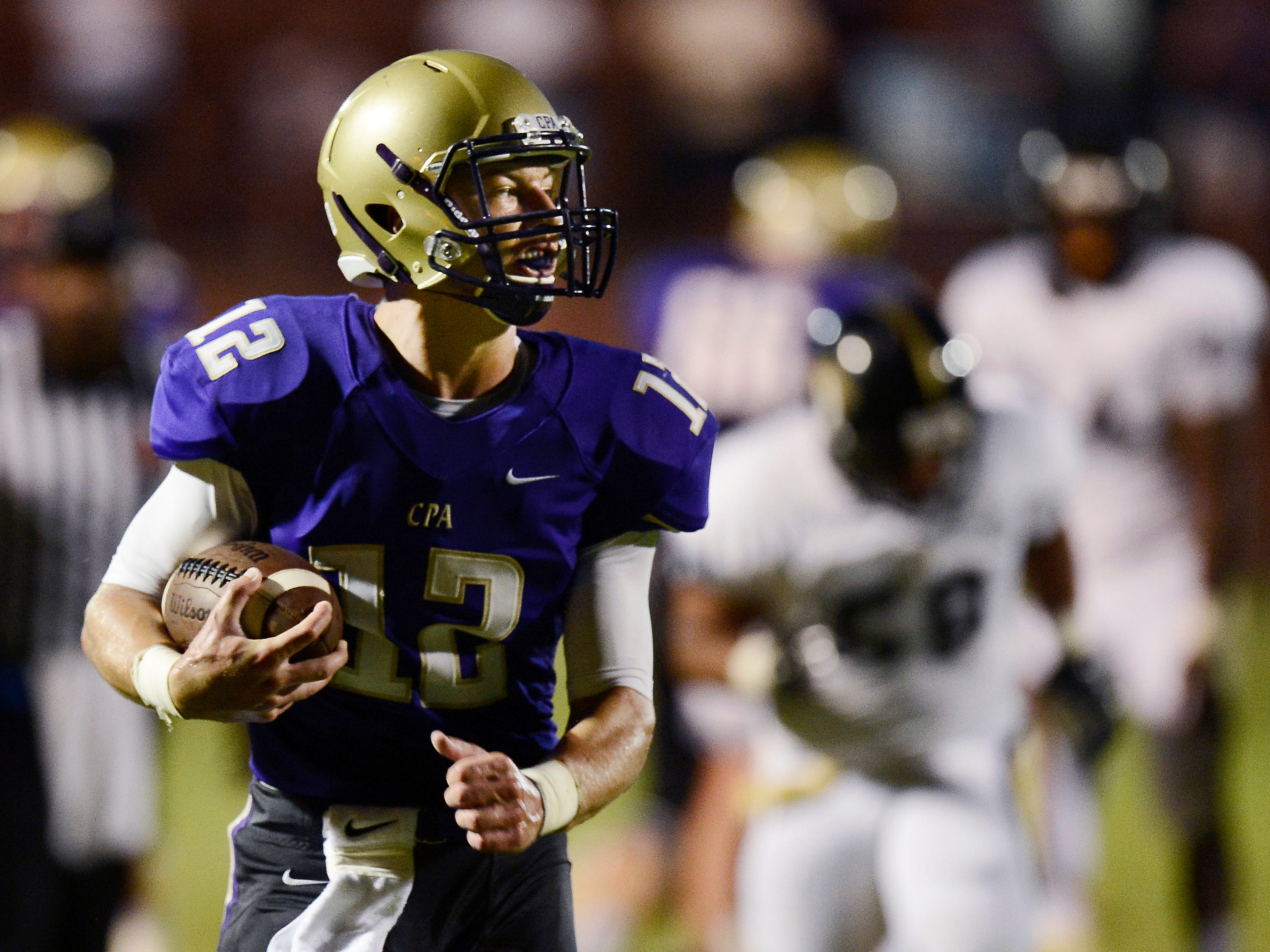 CPA quarterback Jay Hockaday (12) runs for a touchdown against Giles County earlier in the season. The Lions are unbeaten heading into Friday’s matchup against Marshall County.