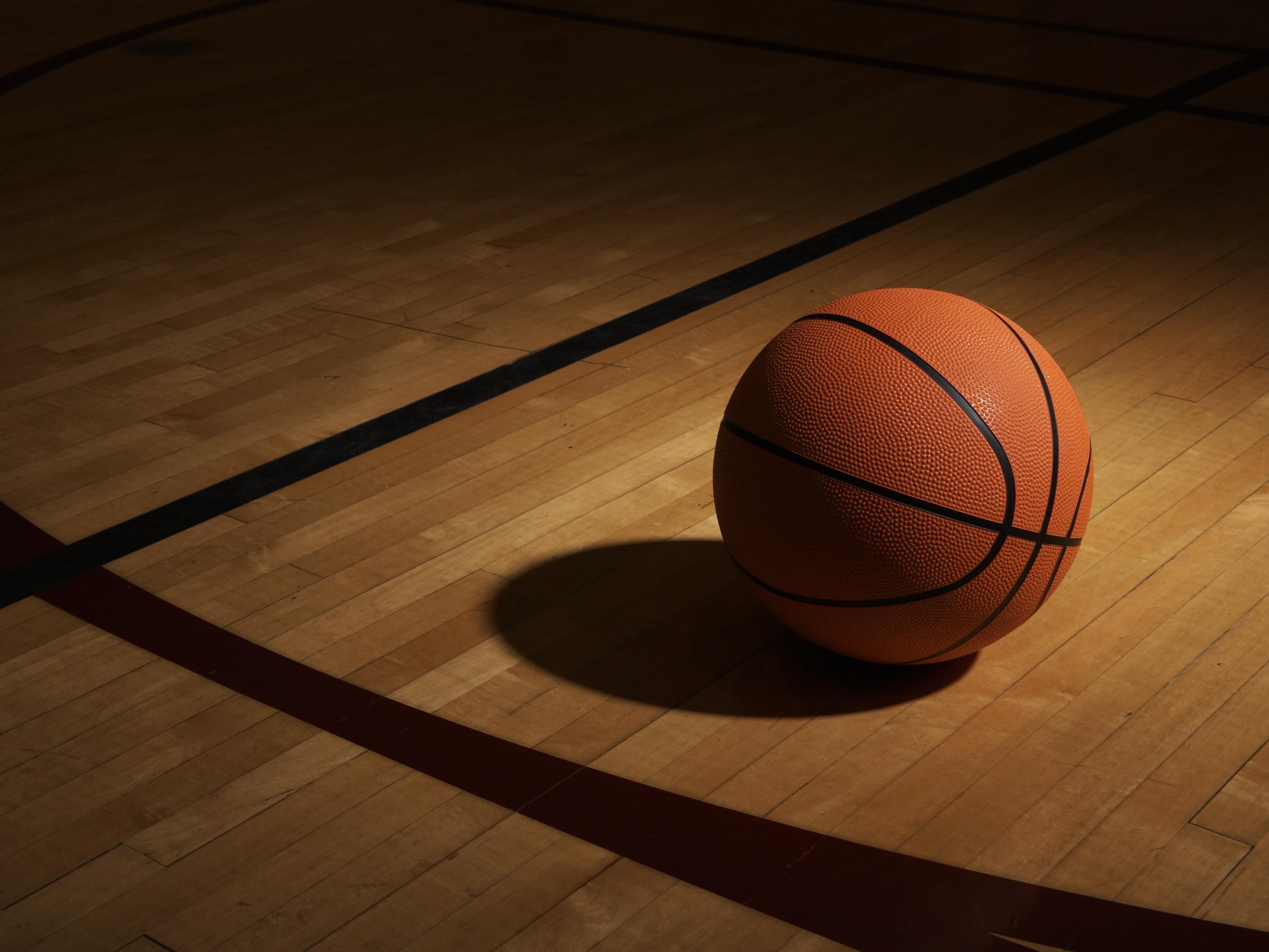 Basketball on basketball court, elevated view