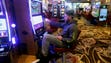 Anthony Palermo, of Rochester, plays a slot machine