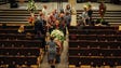 Friends of  Leon Russell follow his casket as they