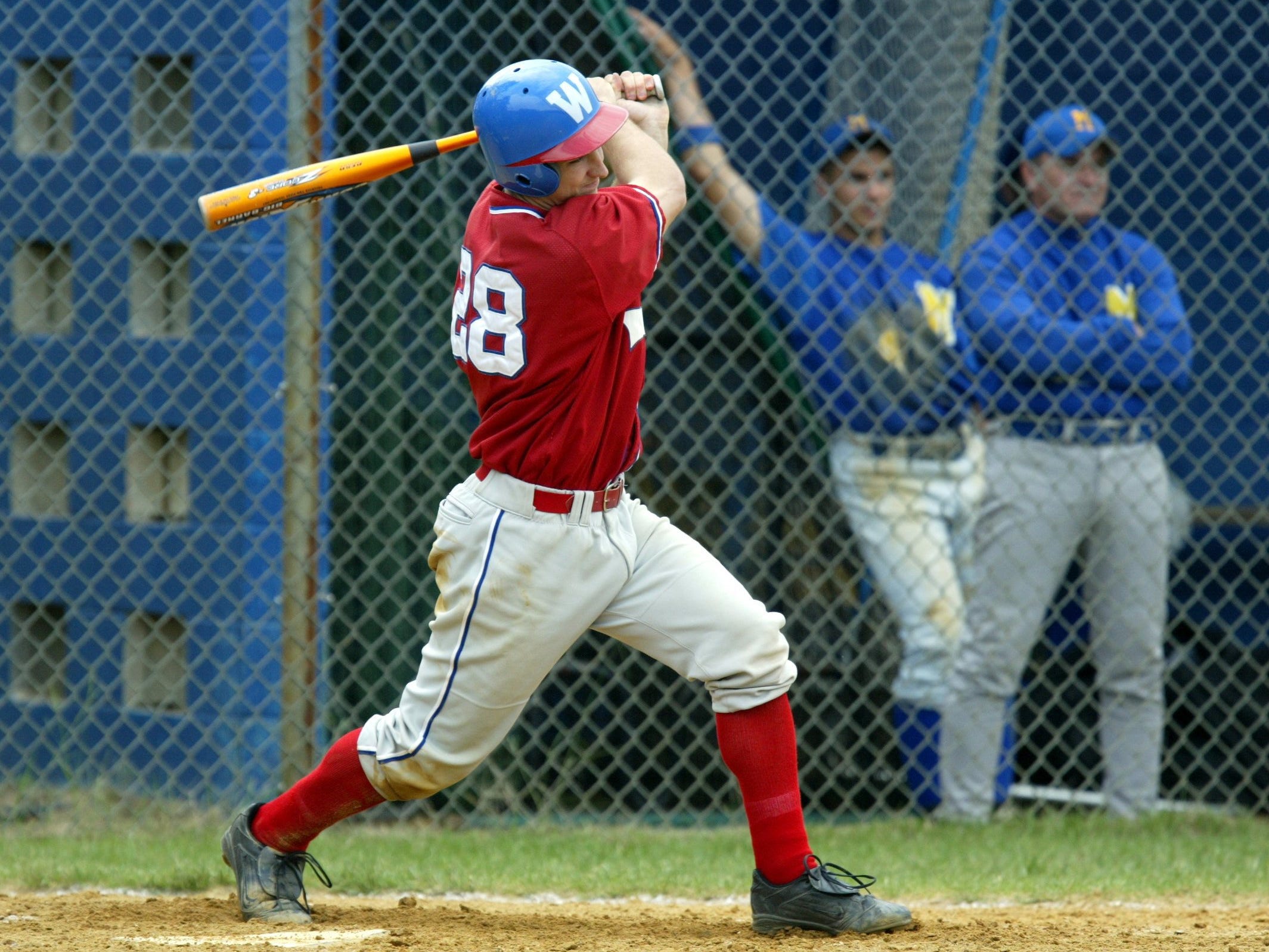 Wall’s Evan Baubles rips a ball in a 2003 game. By the end of his career a year later, he was the Crimson Knights’ all-time home run leader with 18. .